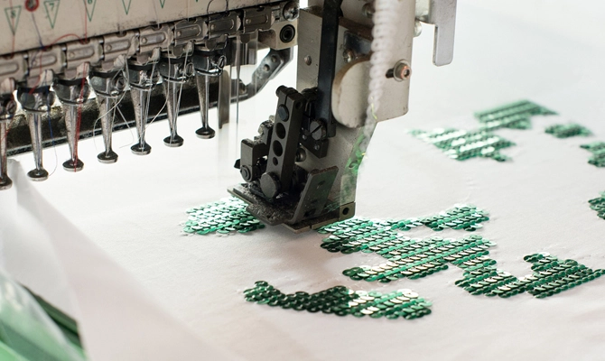 Professional office uniform featuring precise electronic embroidery details